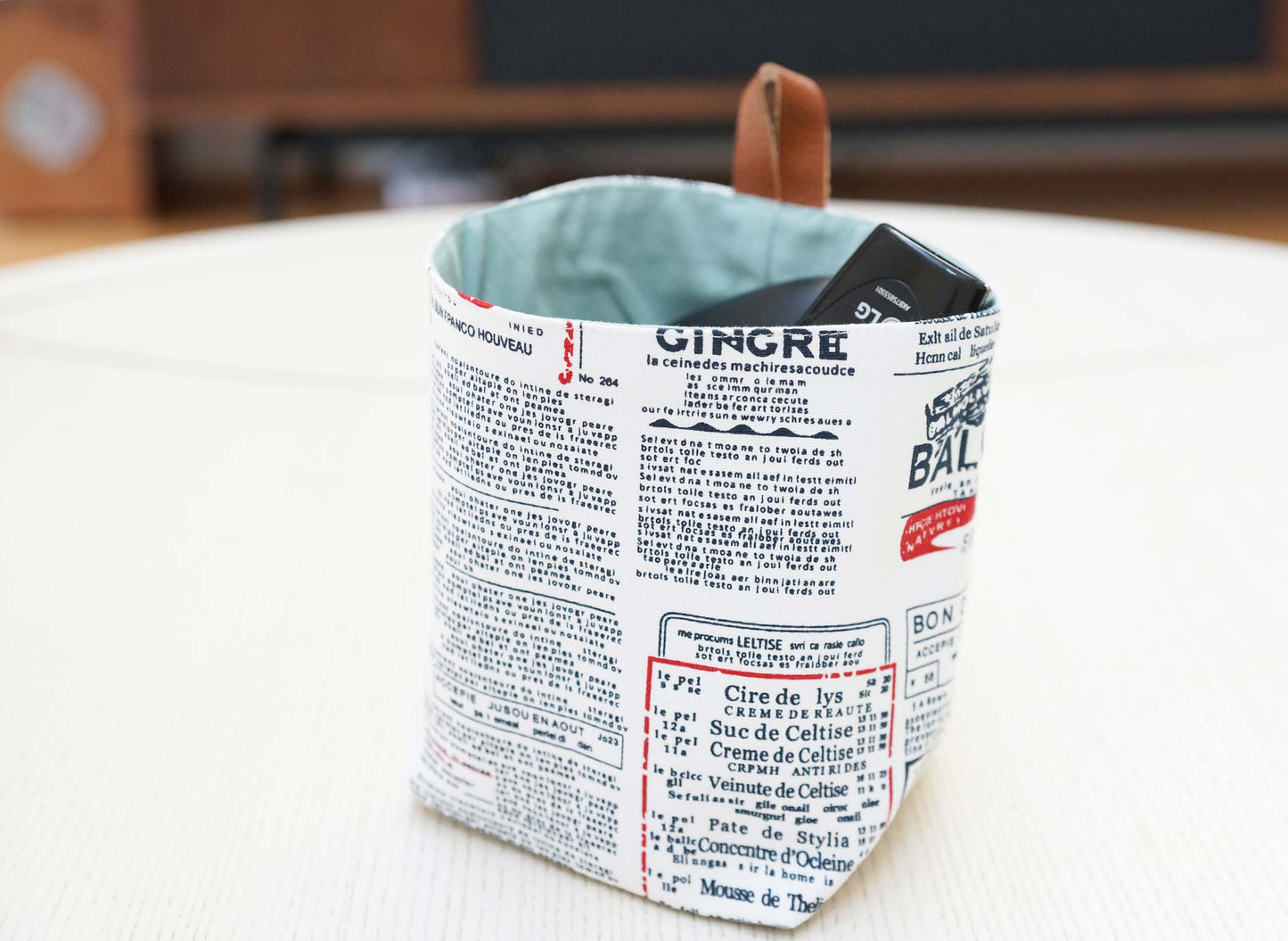 Newspaper Words Fabric Basket with Leather Hang Loop